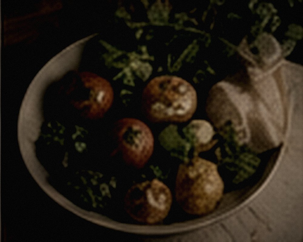 A bowl of vegetables on a wooden counter