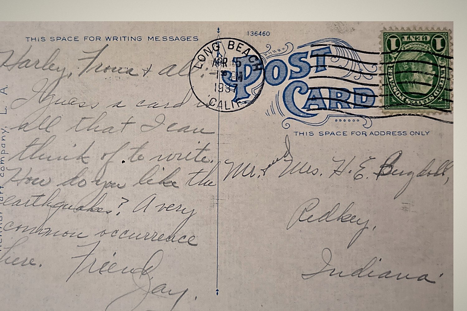 A 1933 postcard, handwritten, with its transcription set beneath