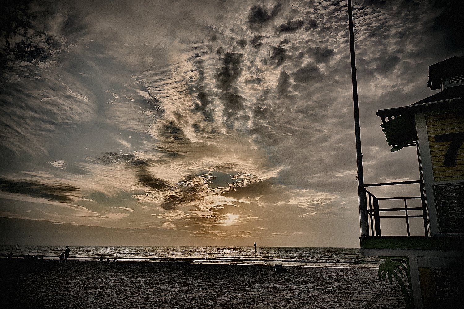 The Gulf at sunset, cloud breaking over the water